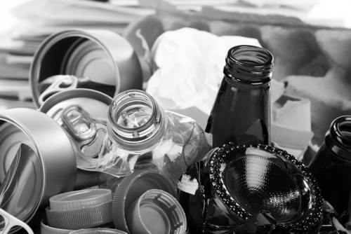 Staff loading commercial waste into vehicle